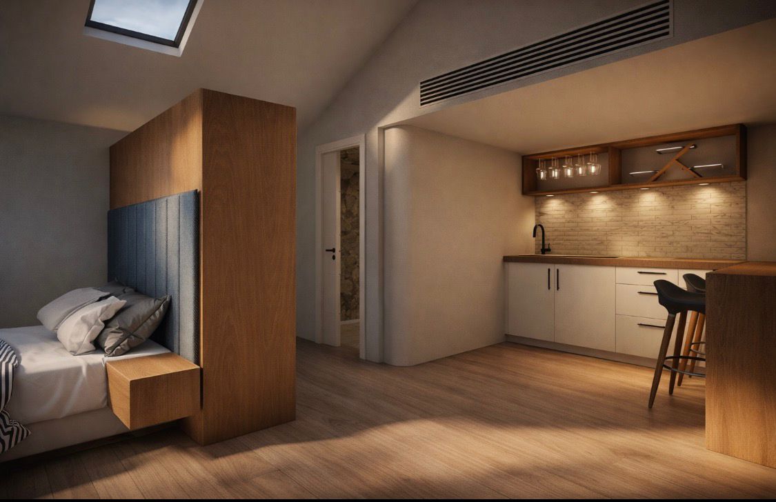 Bedroom with wood divider and skylight