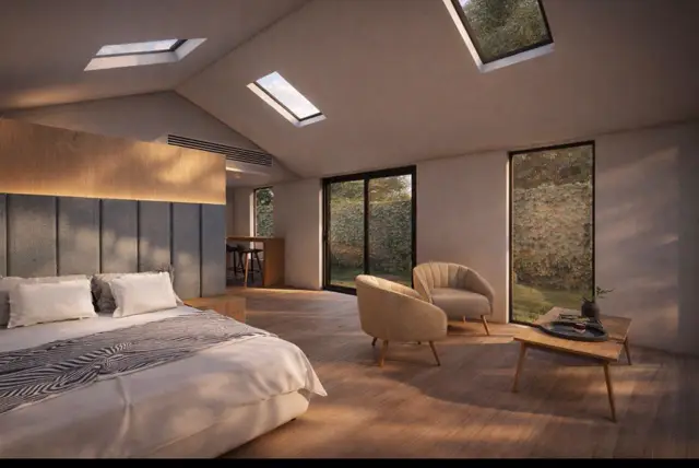 Bedroom with skylights and backlighting